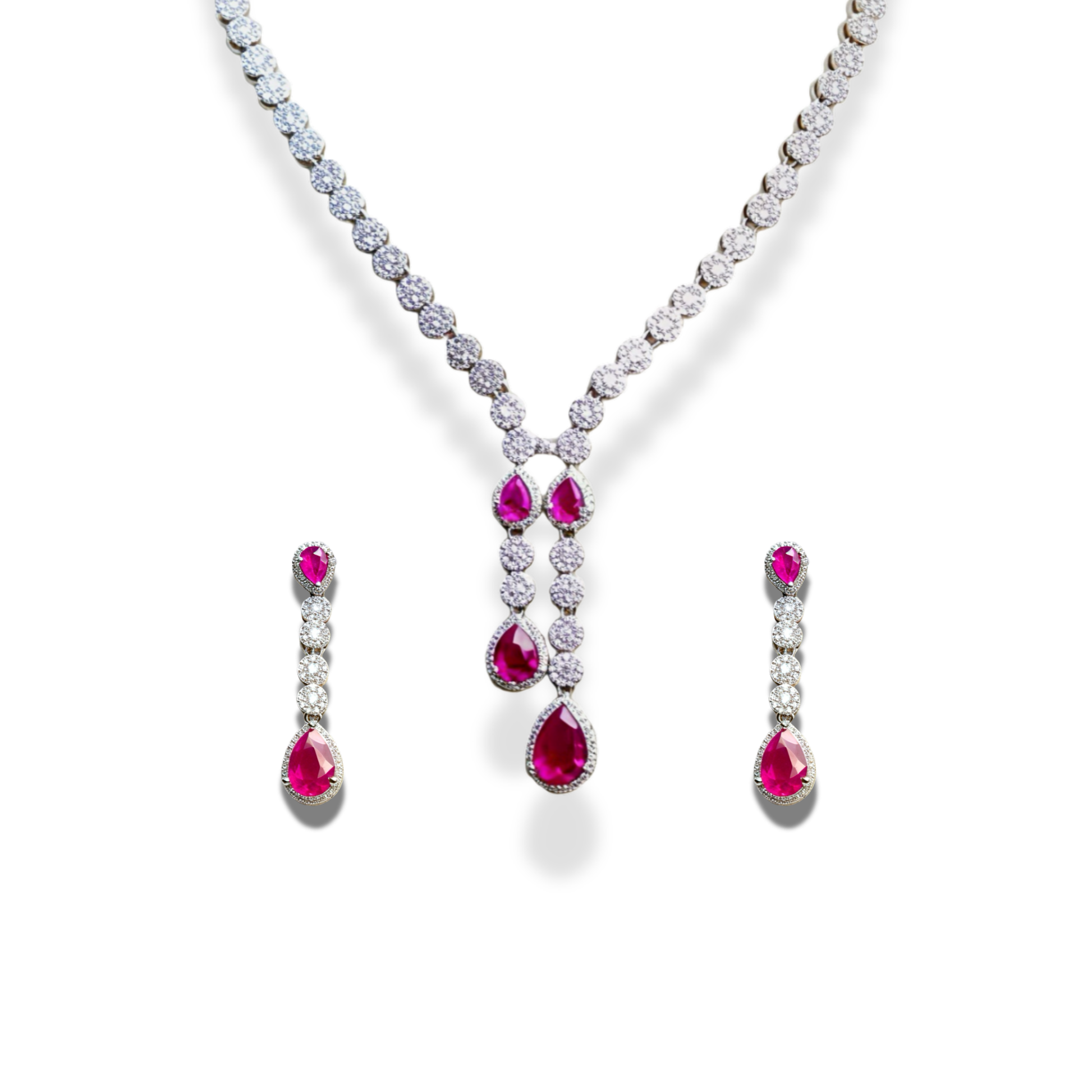 American Diamond Teardrop Set, A dazzling ensemble tailored for cocktail nights, formal galas, weddings, or high-profile celebrations. This refined set adds an air of glamour to evening gowns, sarees, or chic contemporary outfits. Whether you're attending a reception or walking into a luxurious dinner party, its brilliance ensures you remain the center of attention with effortless grace. Material & Care Material: Gold Alloy, sterling silver, silver, brass, aluminium Plating: Silver Plating Stones: AAA-Grade