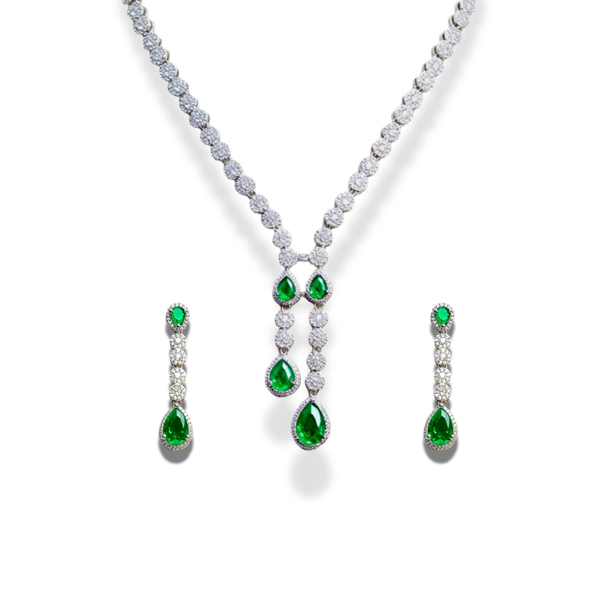 Jewelry set with emerald and diamond necklace, earrings on a white background