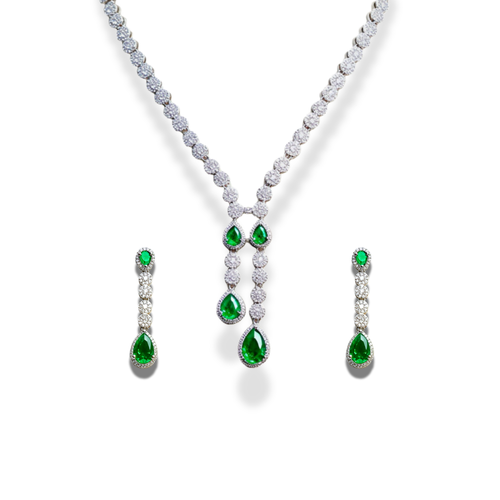 Jewelry set with emerald and diamond necklace, earrings on a white background